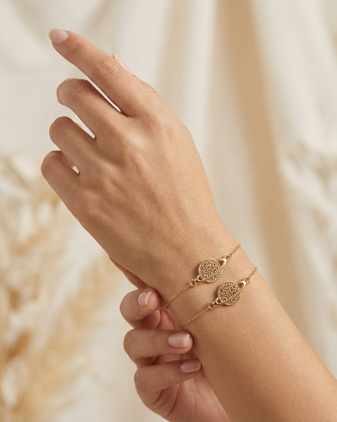 14k Gold bracelet with Saturn charm